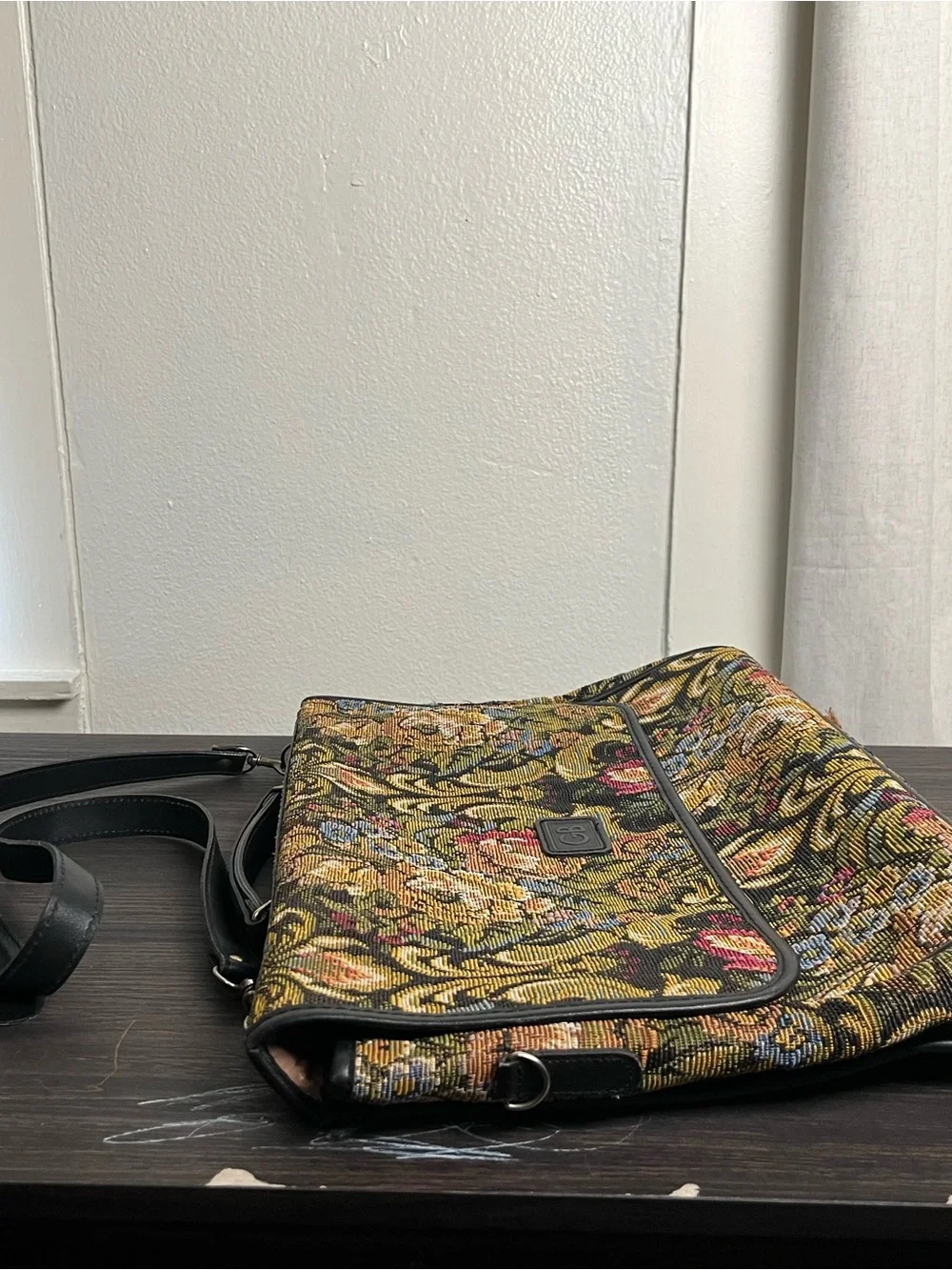 Geoffrey Beene messenger bag ft vibrant floral tapestry ext & black leather trim